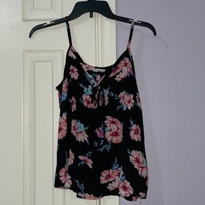 Black tank top with pink flowers. Size medium.